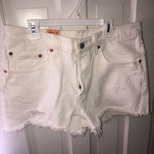 Levi’s distressed white denim shorts, size 30